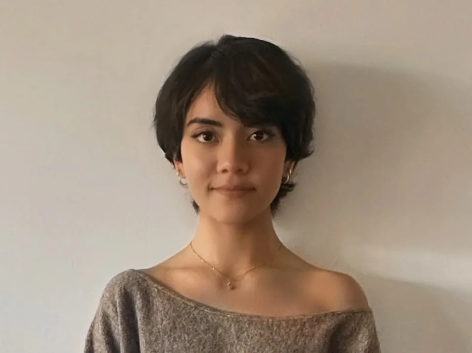 Client with a short, dark pixie cut